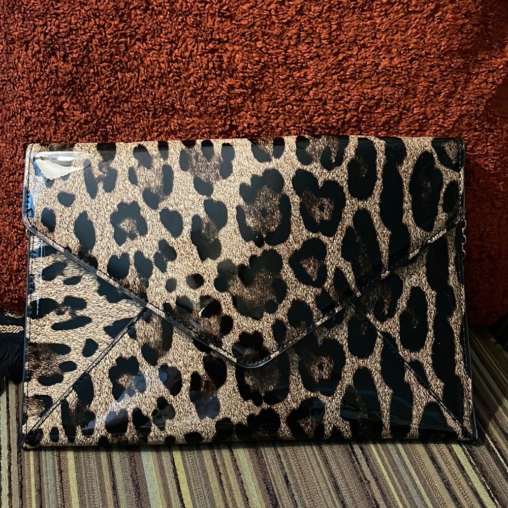 Animal print envelope style clutch purse. Never used. NWOT.